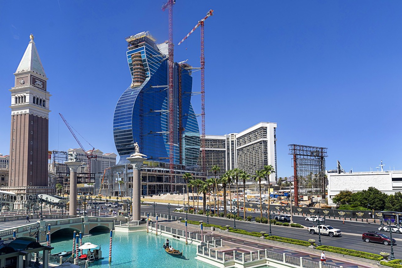 Las Vegas Strip construction with cranes and hotel towers beside the canal